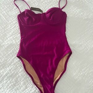 One piece bathing suit. New, unused, with tag